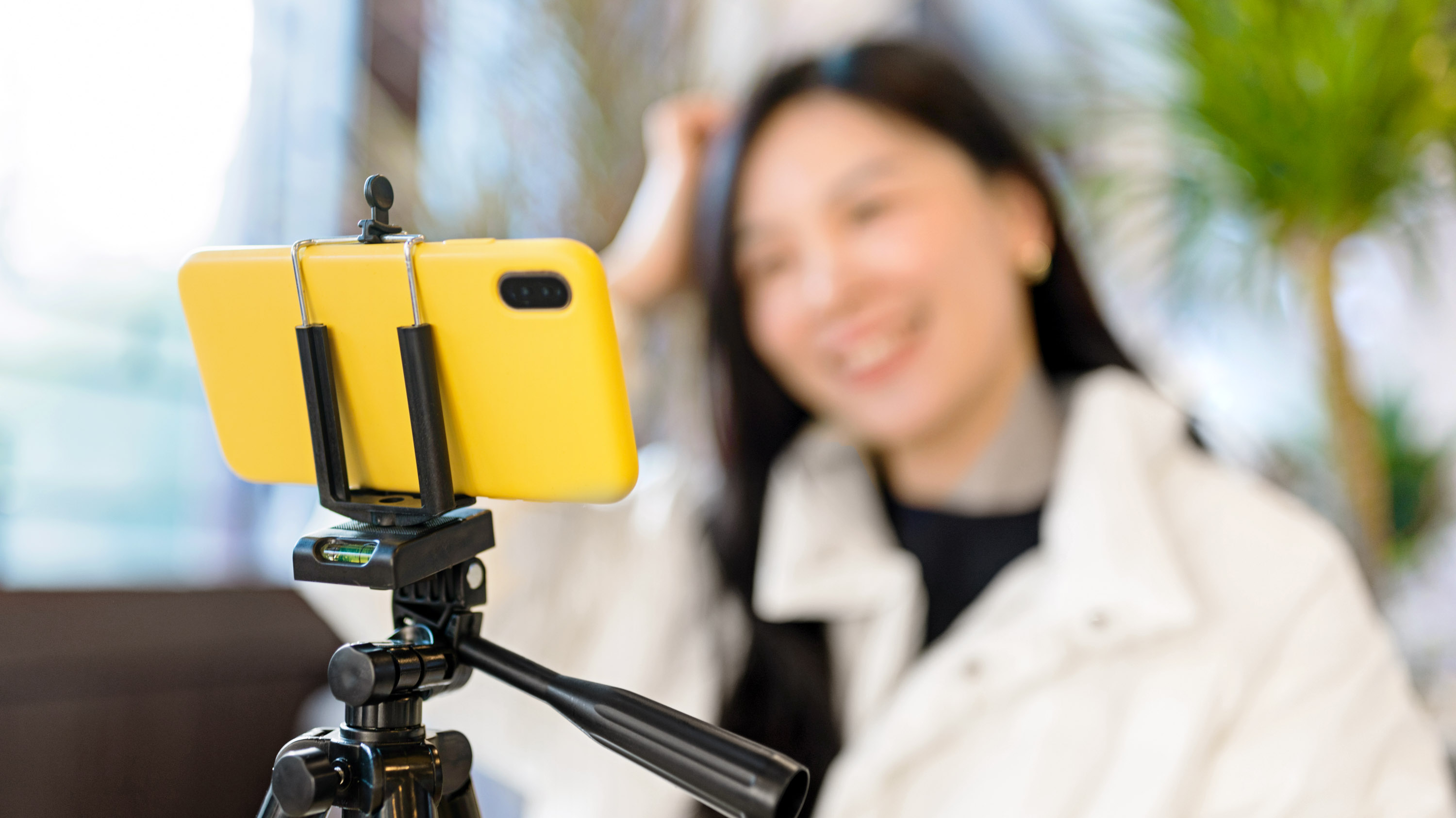 woman livestreaming from phone