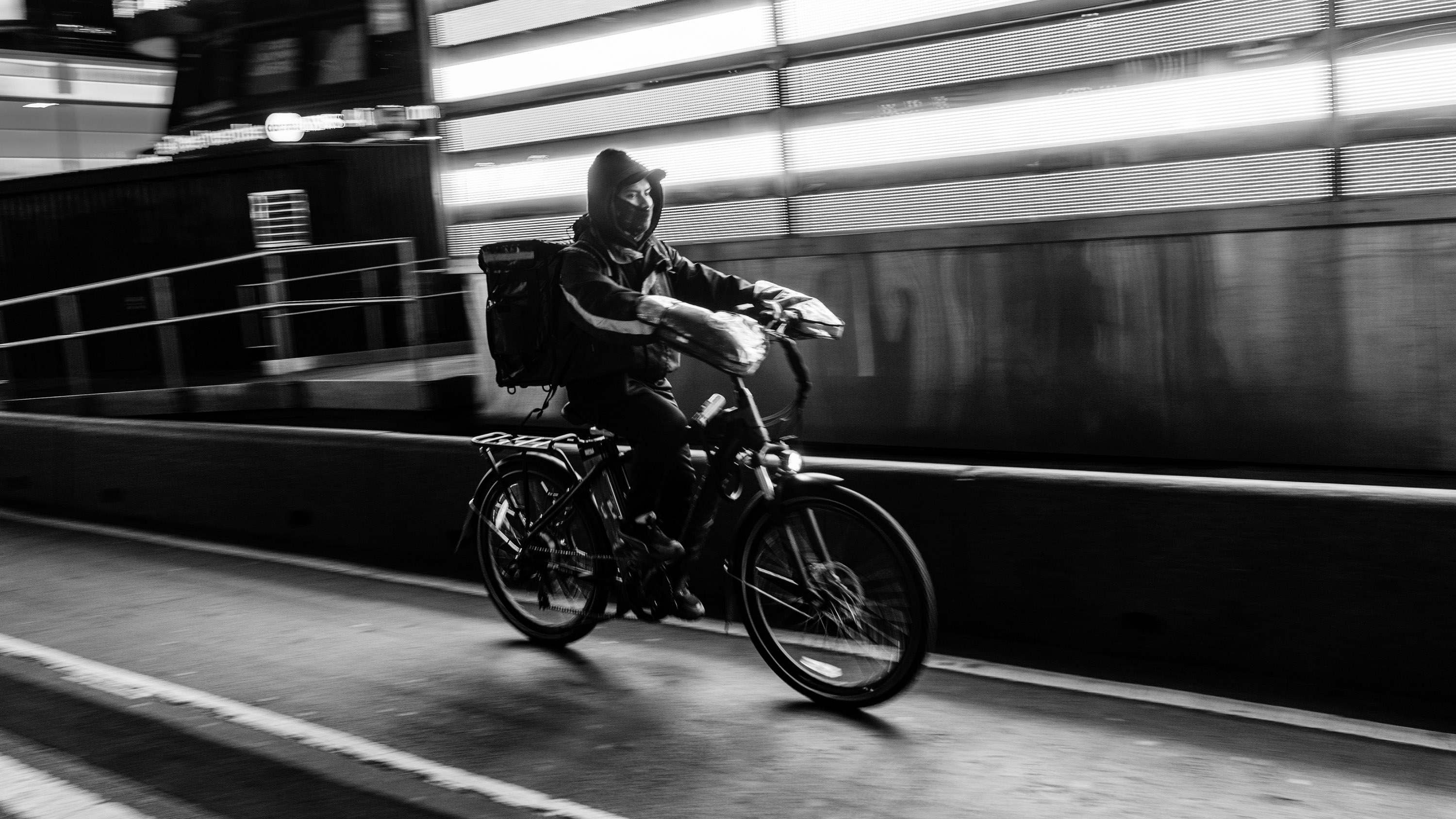 food delivery worker riding an electric bicycle